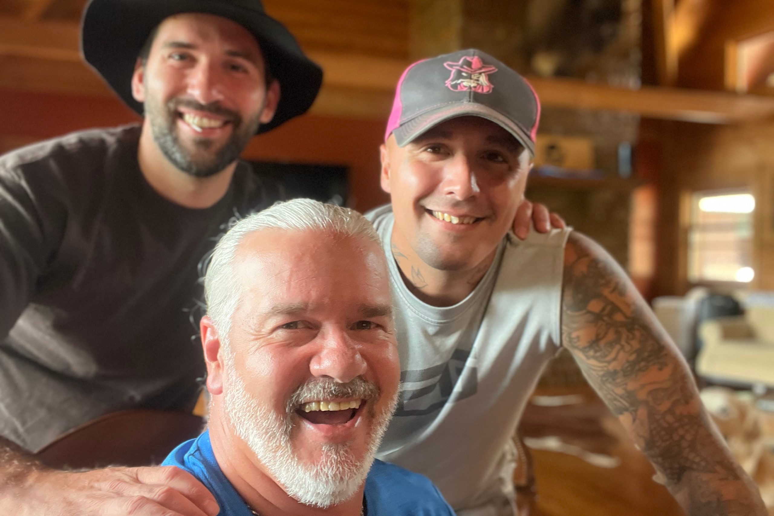 Tony Cash with two men who graduated from the recovery program